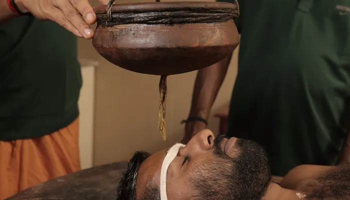 Shirodhara — traditional Ayurvedic warm oil treatment at Agasthya Hospital